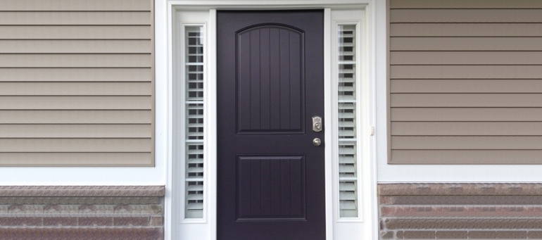 Entry Door Sidelight Shutters Next To Black Door In Orlando, FL